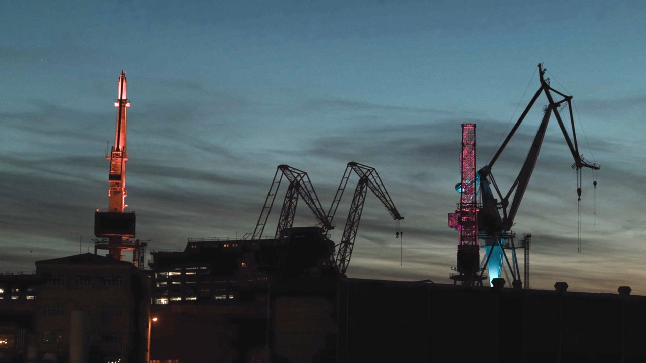 Shipyard cranes at night